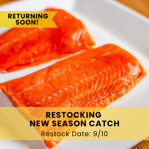 Two raw salmon fillets on a white plate with promotional text about restocking.